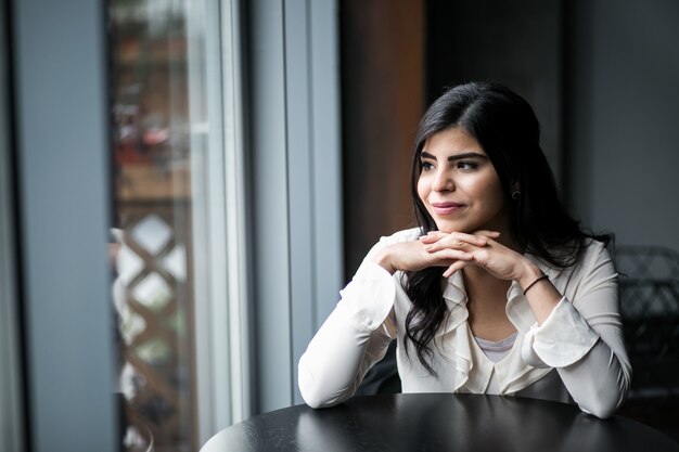 Eastern woman in a cafe