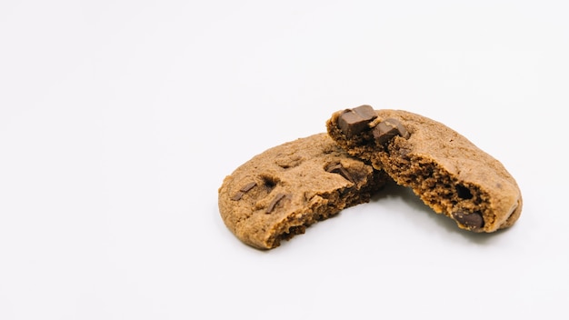 Eaten chocolate cookies on white background