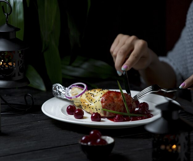 Free Photo eating dinner, beef lamb in tomato sauce with cutlery