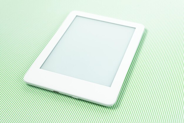 Ebook reader over green striped background