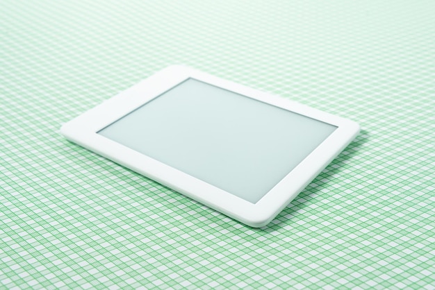 Ebook reader over green striped background