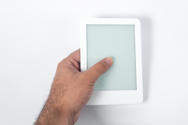 Free photo ebook reader over isolated white background  being held by a male hand