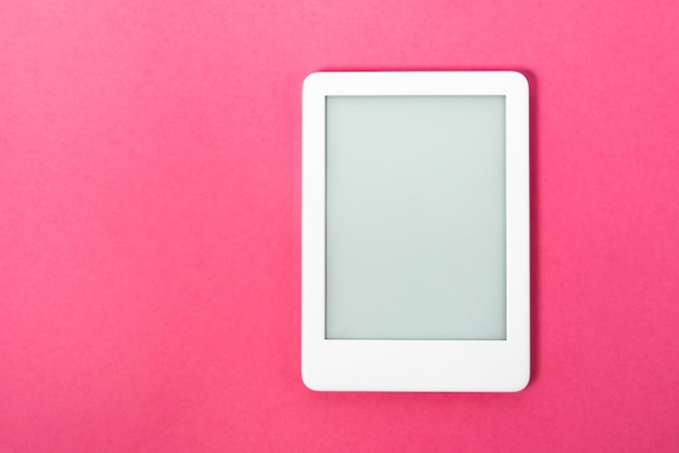 Ebook reader over pink background