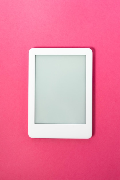 Ebook reader over pink background