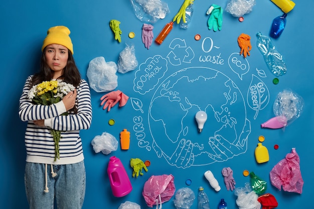 Eco volunteer next to environment wastes collage