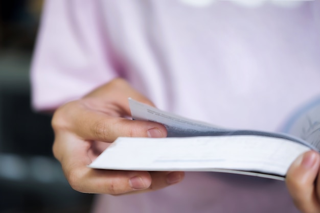 Free photo education concept. girl reading a book in library of school.