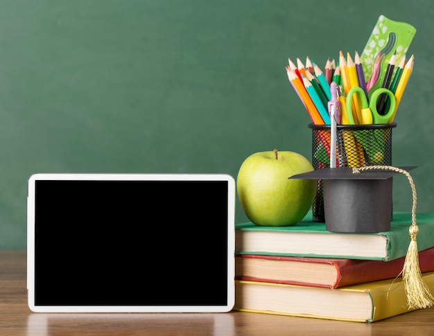 Education day assortment on a table with a tablet