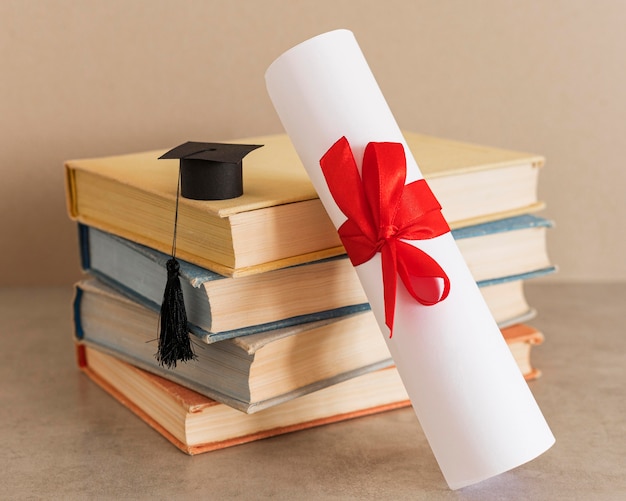 Free Photo education diploma certificate with red ribbon and bow