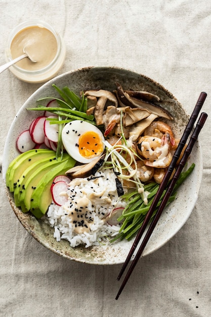 Egg and prawn served with tahini sauce in flat lay photography style