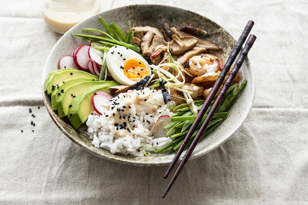 Egg and prawn served with tahini sauce photography