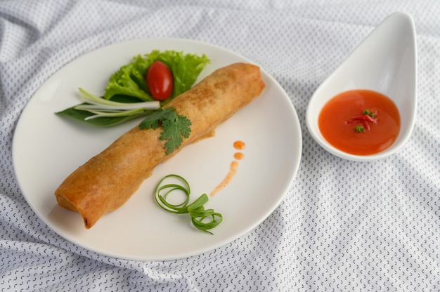 Egg roll or Fried Spring Rolls on the white plate Thai food. .