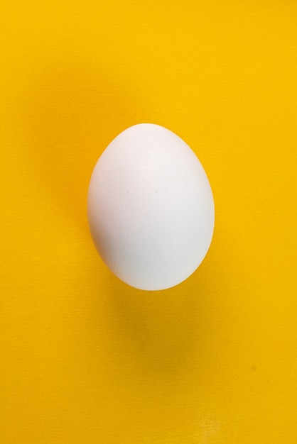 Free photo egg on the yellow background