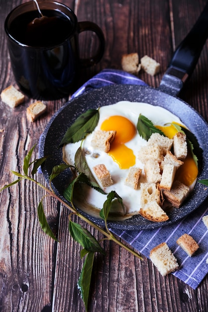 Free photo eggs and breadcrumbs breakfast on wooden table