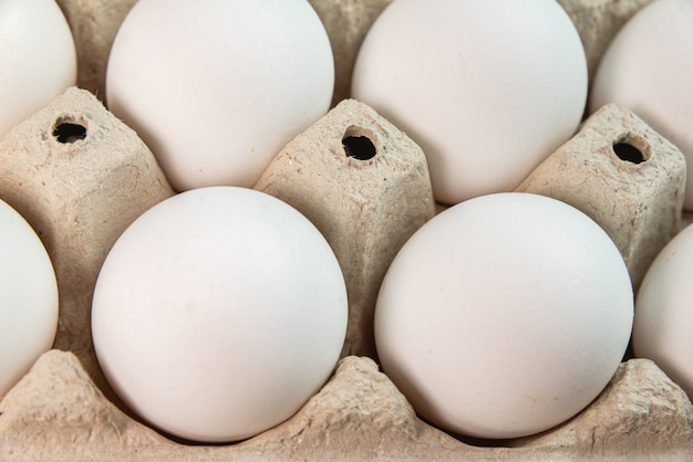 Free photo eggs on the brown surface