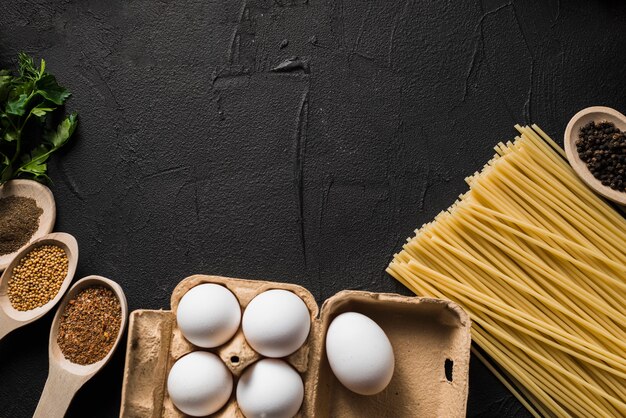 Eggs and pasta near spices