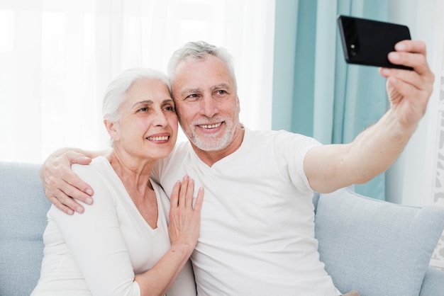 Elder couple making a selfie