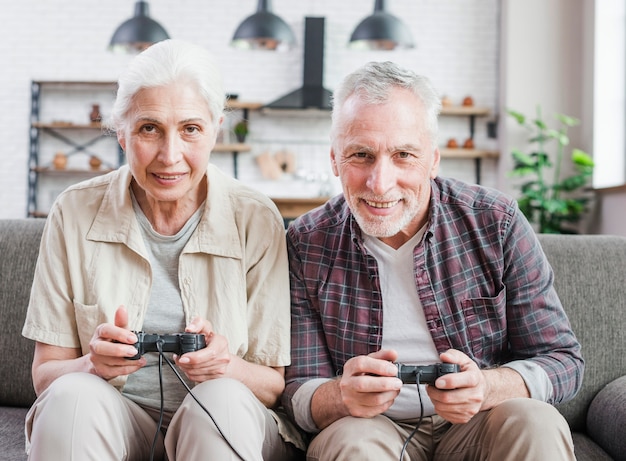 Elder couple playing video games together