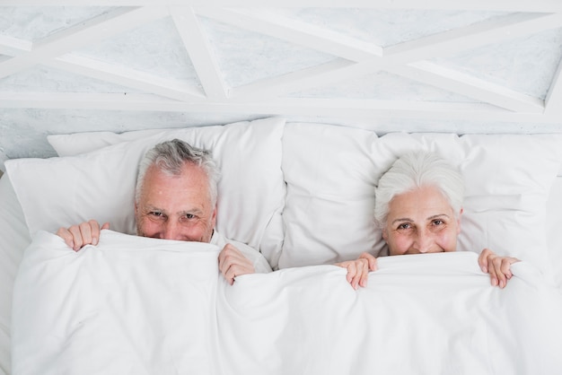 Elder couple posing for a photo