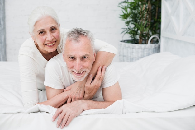 Elder couple posing for a photo