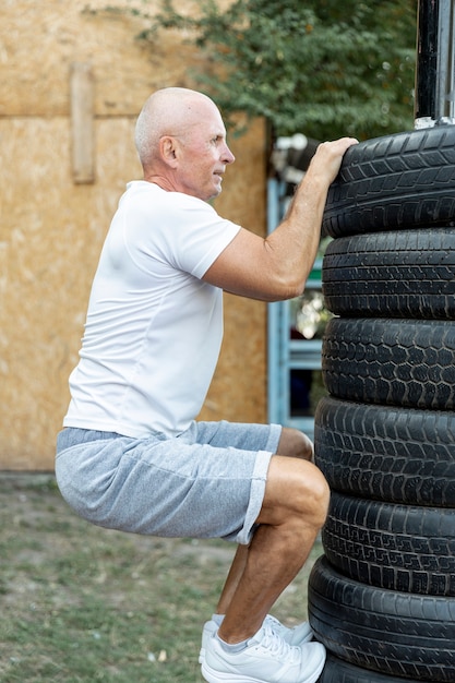 Elder man practicing endurance outdoors