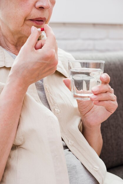 Elder woman having her medicines