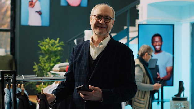 Free Photo elderly client looking for formal blazers at shopping mall