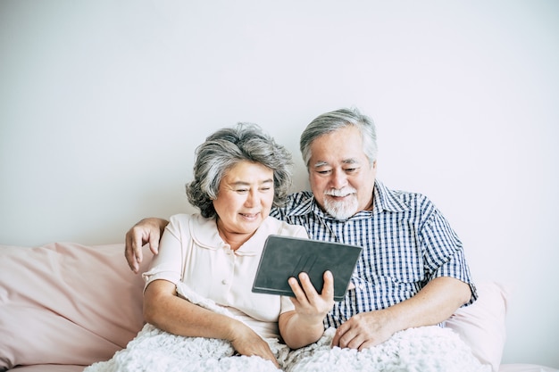 Elderly Couple Using tablet computer