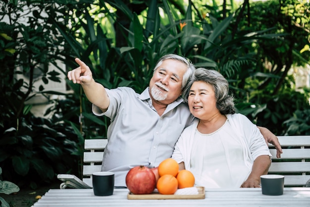 Elderly Couples Playing and eating some fruit