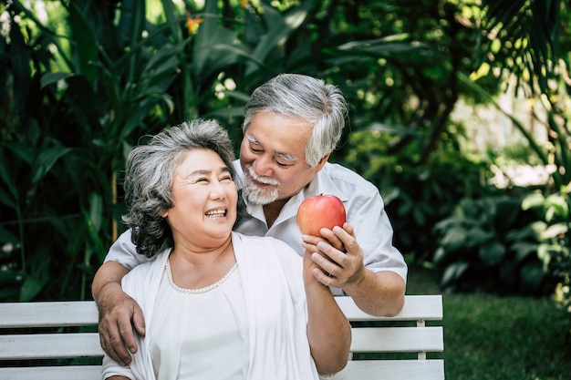 Elderly Couples Playing and eating some fruit