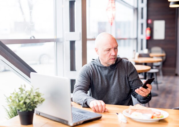 Elderly man using mobile phone