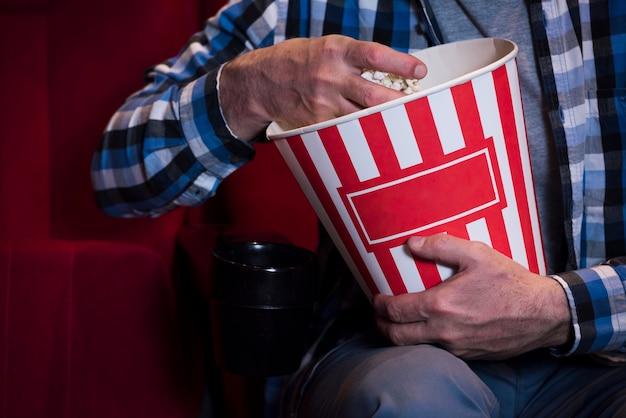 Elderly man watching movie in cinema