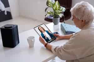 Free photo elderly people making a video call