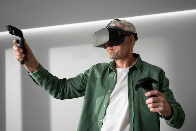 Free photo elderly person using vr set for game immersion