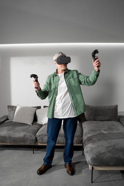 Elderly person using vr set for game immersion