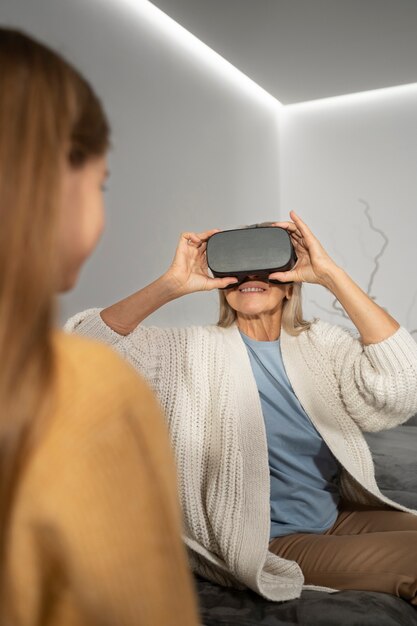 Elderly person using vr set for game immersion