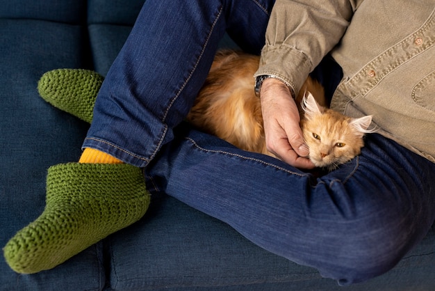 Free Photo elderly person with pet cat