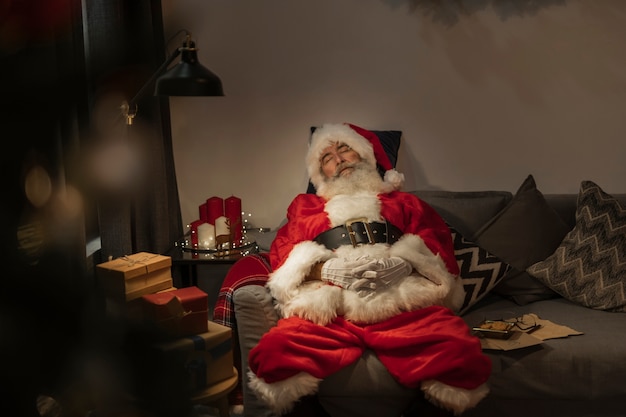 Elderly santa claus sleeping on the couch