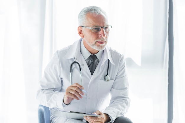 Elderly therapist listening to patient