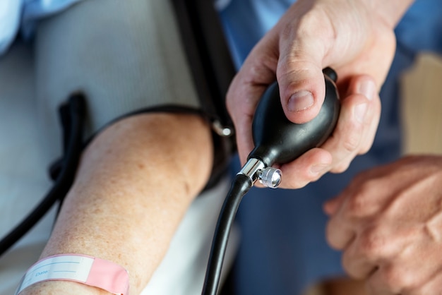 Free Photo elderly woman checking blood pressure