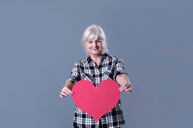 Free Photo elderly woman holding heart