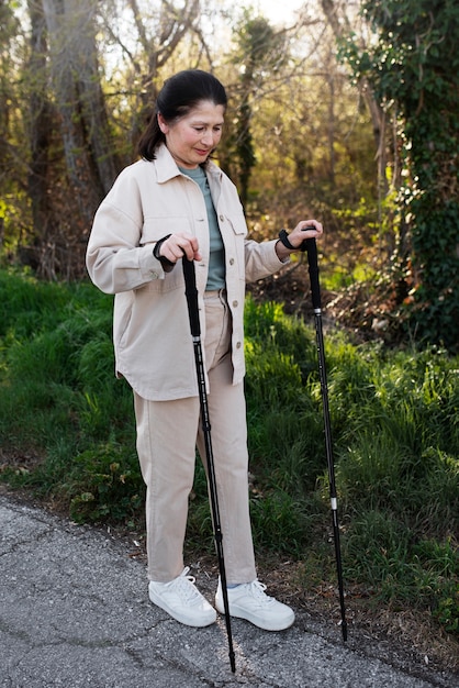 Free photo elderly woman walking in park