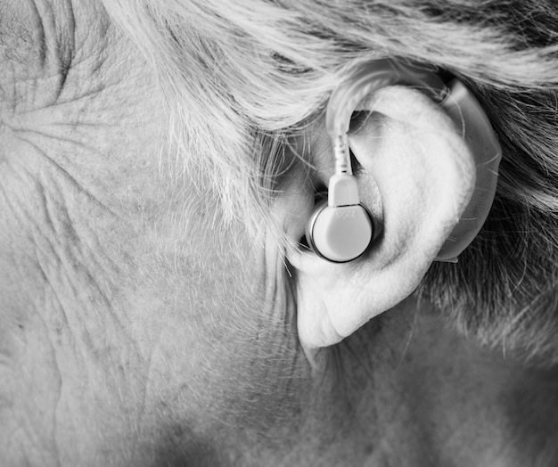 Elderly woman wearing a hearing aid