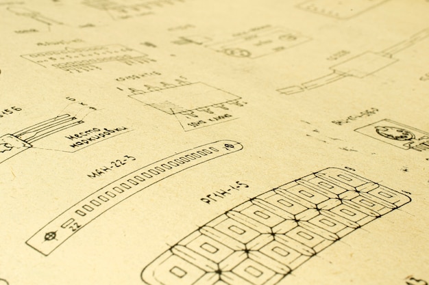 Free photo electric radio elements printed on old vintage paper as background for education, electricity industries, repair footage etc. selective focus with depth of field.