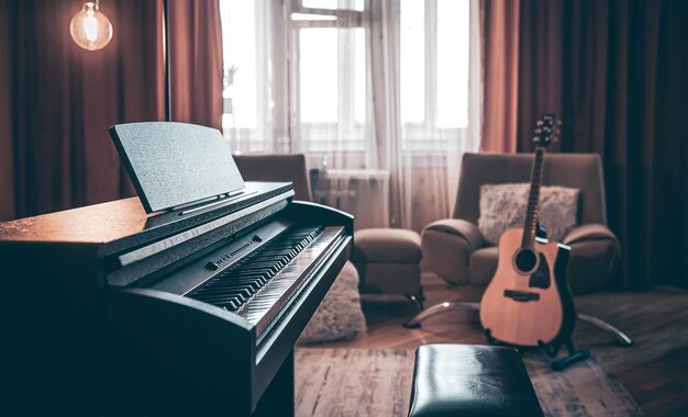 Electronic piano in the interior of the room on a blurred background