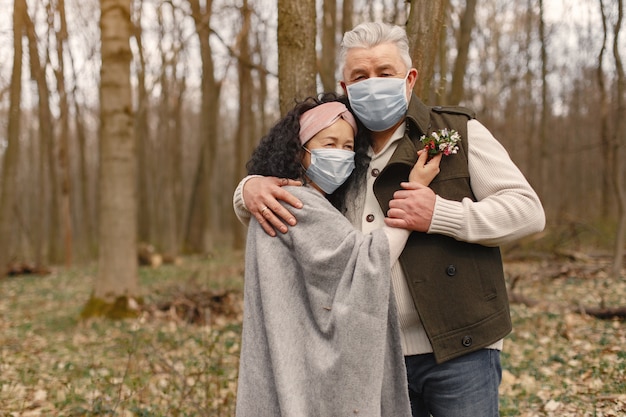 Elegant adult couple in a spring forest