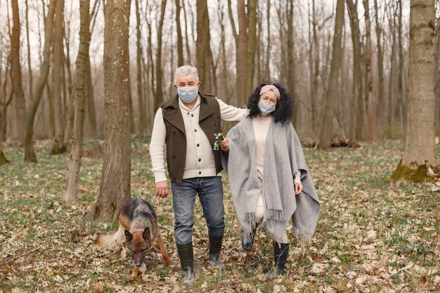 Elegant adult couple in a spring forest