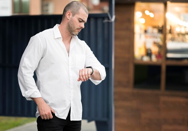 Elegant adult male waiting for the bus