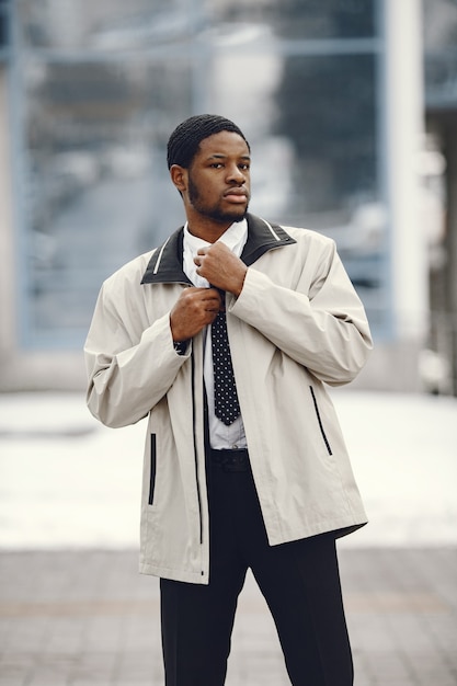 Elegant African American man standing in the street.