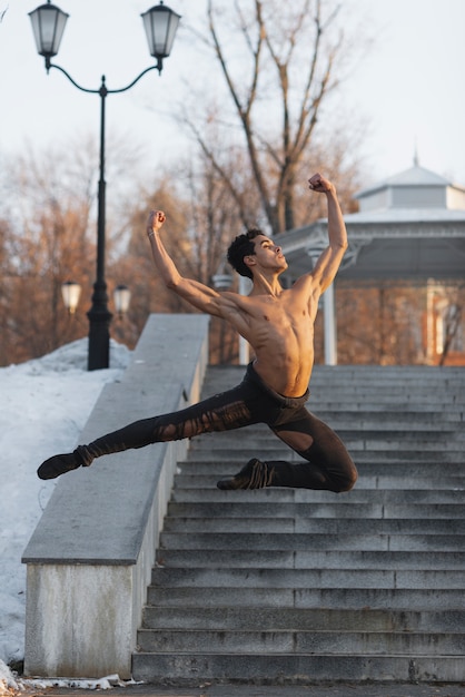 Elegant ballet position performed by young man