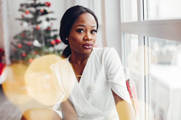 elegant black girl in a room at Christmas